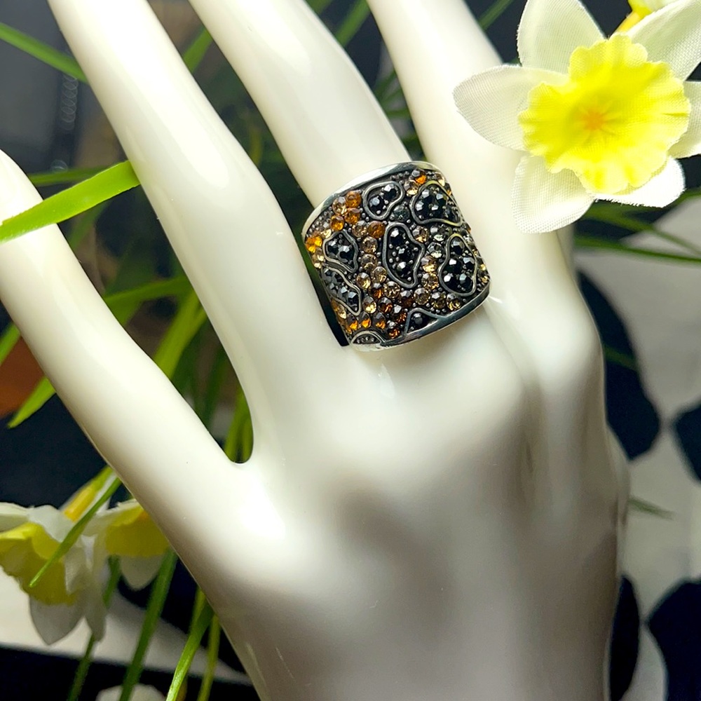 Brighton ring with gold and black crystals.